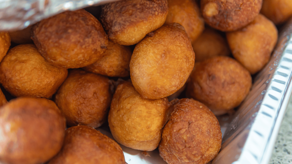 Tin pan filled with fried Nigerian puff-puff